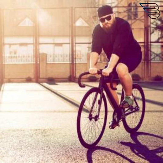 Man on bike in bright room